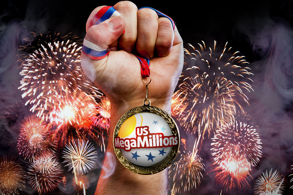 Fist clutching MegaMillions winner's medal in front of firework display