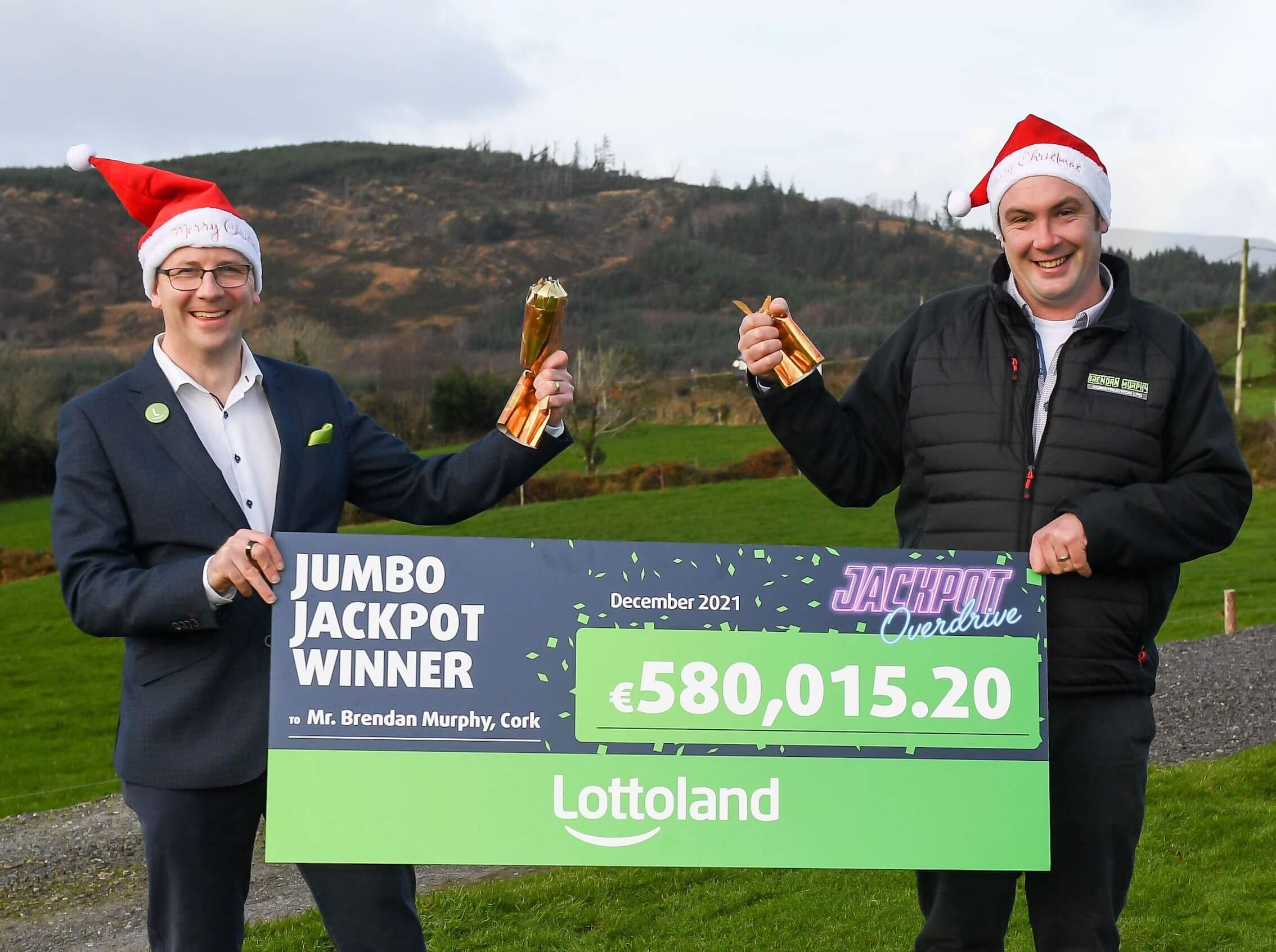 Lottoland winner Brendan Murphy being presented with a cheque for jackpot win by Graham Ross of Lottoland